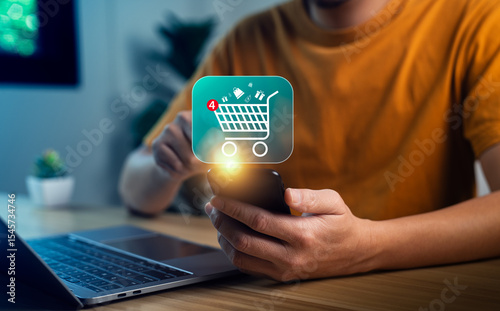 Close-up hand holding smartphone with glowing shopping cart icon and notification badge, symbolizing mobile shopping app, digital e-commerce, online retail, internet purchase, smart consumer behavior
