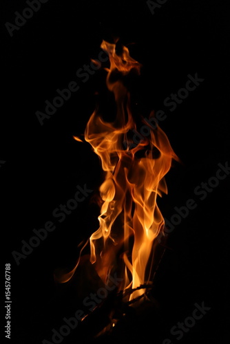 Fire flames on black background. Closeup of fire flames isolated on black background
