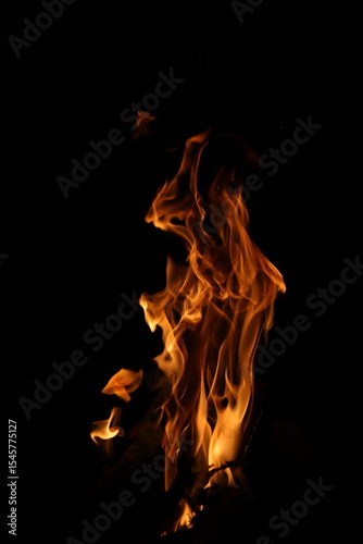 Fire flames on black background. Closeup of fire flames isolated on black background