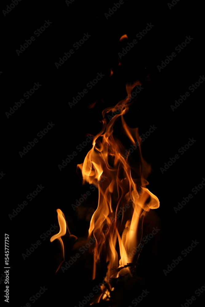 Fototapeta premium Fire flames on black background. Closeup of fire flames isolated on black background