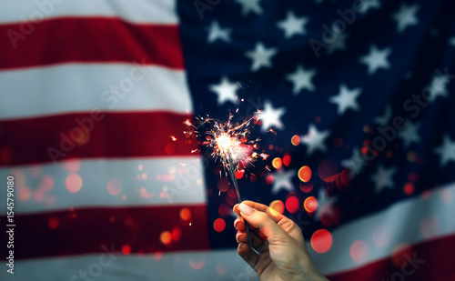Celebration 4th of July.Patriotic holiday, Flag day. Independence ,Labor,Memorial Day. Concept of Celebration. Sparklers in hand on an American Flag background. Independence day United States. 