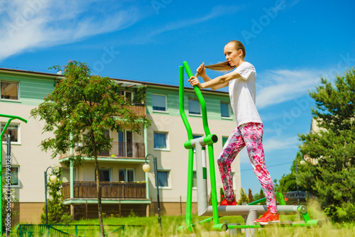 Girl exercise at outdoor gym area
