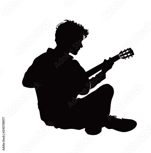 Silhouette of a young male musician playing guitar on a white background.