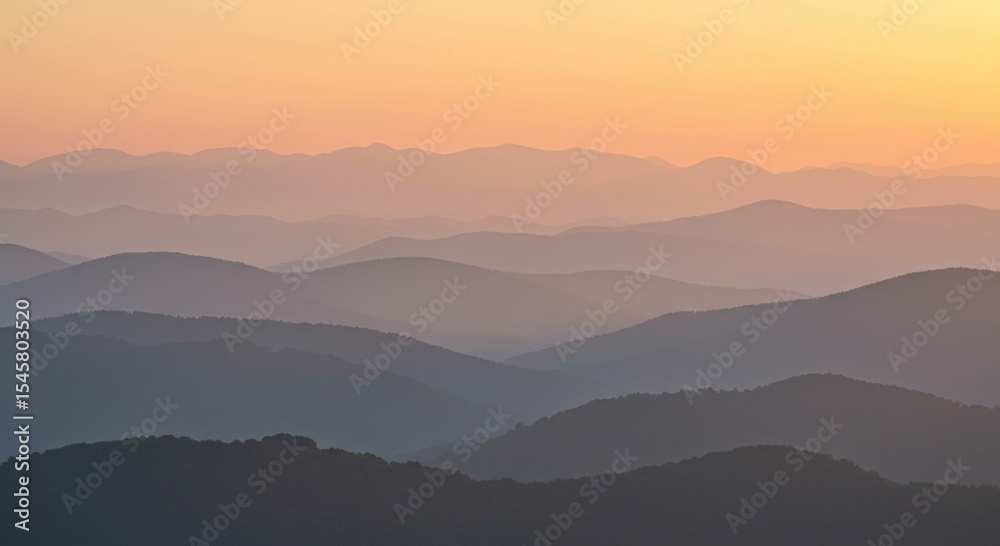 Obraz premium Misty sunrise over mountain range