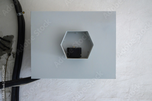 interior of building with electrical junction box and cable on wall