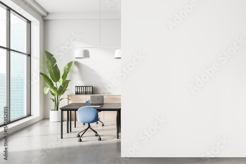 Modern office interior with minimalist design, blue chairs, large windows and green plant beside a white wall in natural light ambiance. 3D Rendering