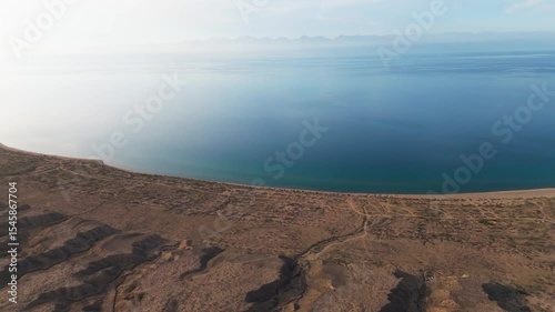 Aerial view  Issyl Kol lake , travel destination in Kyrgyzstan at sunset 