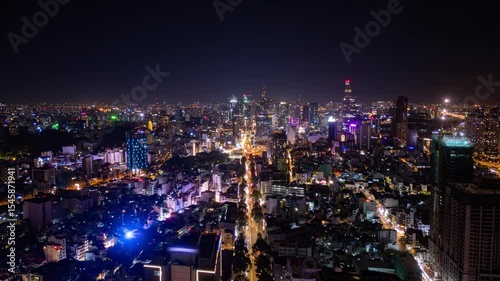 Ho Chi Minh City skyline with street traffic at night in Aerial Timelapse, Vietnam 