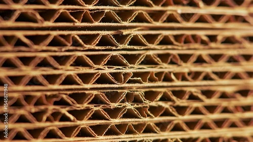 Stack of corrugated cardboard sheets, cut to reveal wavy interior