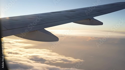 Wing over clouds at sunset