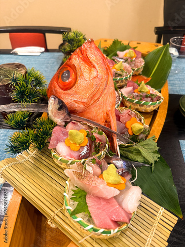Traditional Japanese sashimi boat platter with kinmedai and assorted seafood