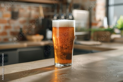 High Resolution of Frothy Beer in Pint Glass on Bar Counter photo