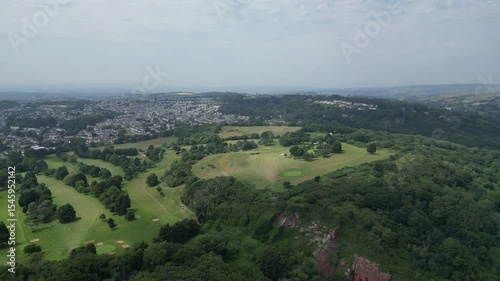 Torquay, Torbay, South Devon, England: DRONE VIEWS: Torquay golf course with the town of Torquay and the coastline in the background. Torbay is a popular UK holiday destination (Clip 1 of 2).