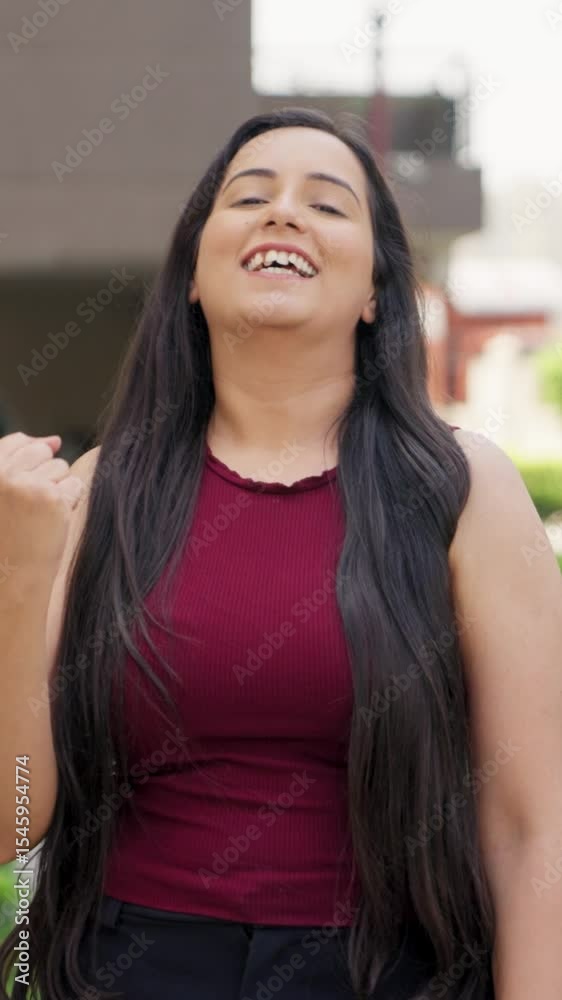 Vertical Video of Indian Woman Winning Game and Smiling at camera Vertical Video of Indian Woman Winning Game and Smiling at camera