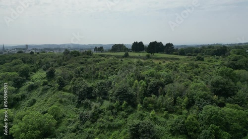 Torquay, Torbay, South Devon, England: DRONE VIEWS: The drone rises over the coastline to reveal Torquay golf club and the town on the horizon. Torbay is a popular UK holiday destination.