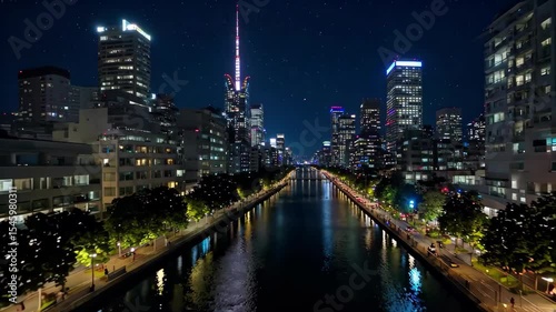 Wallpaper Mural nighttime view of a city with a river and a city street Torontodigital.ca