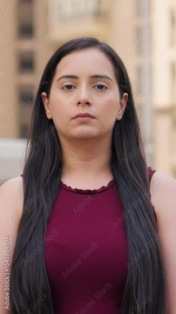 Vertical Video of Indian Woman with Poker Face looking in the Camera Vertical Video of Indian Woman with Poker Face looking in the Camera