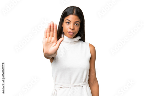 Canvas Print Young African american woman over isolated background making stop gesture