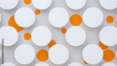 Abstract background with white circles and orange dots on a light gray wall