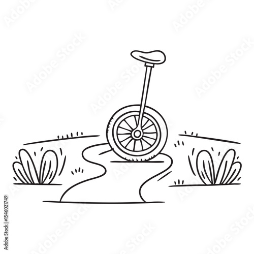 A unicycle lying on its side along a garden walkway