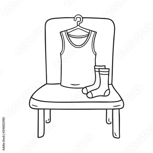 An undershirt placed on a chair beside neatly arranged socks