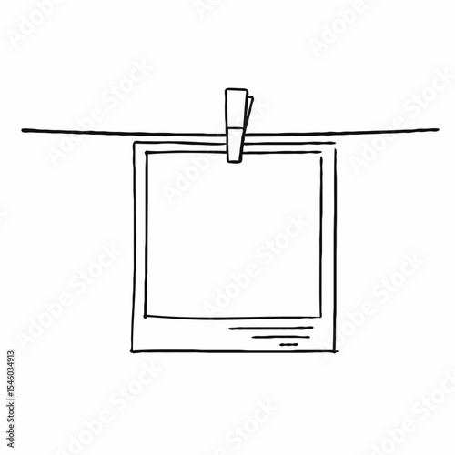Blank photo frame hanging on a string with a clothespin  