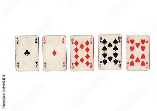 Foto A poker hand of old grubby playing cards isolated on a white background