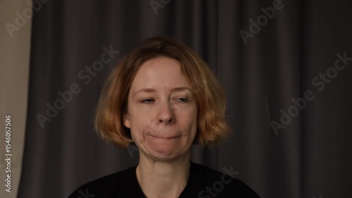 Worried scared woman at home, battling fear and isolation, reflecting on mental health, dealing with feelings of despair and sadness.