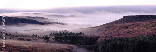 Panorama of early morning mist over Burbage Rocks and Higger Tor, Hathersage, Peak District, UK