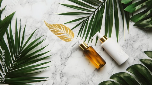  Flat lay of natural cosmetic bottles with palm leaves and a golden leaf on a white marble background