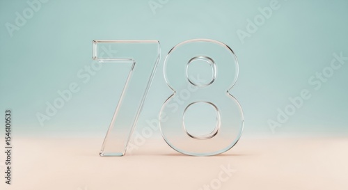 Transparent glass number seventy eight standing on pastel surface with soft background lighting