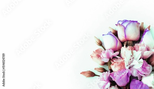 Bouquet of pink roses and alstroemeria on a white background. Delicate flowers. Pastel floral arrangement with a place for text.