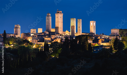 Night view of San Gimignano, Italy, with illuminated medieval towers as skyline