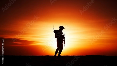 Soldier Silhouette Against Fiery Sunset