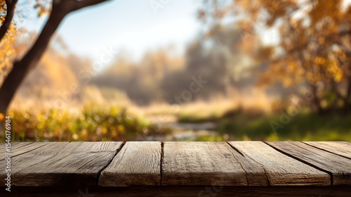 Empty wooden table for product display on autumn nature background