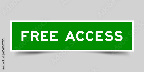 Green color square shape sticker label with word free access on gray background