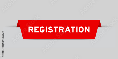 Red color inserted label with word registration on gray background