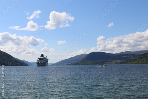 Nordfjordeid, Norway. 31-05-2025. The MS amera at anchor. The ship lifeboats double as quick little water taxis.