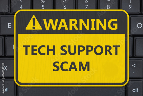 Tech Support Scam yellow warning sign on a computer keyboard