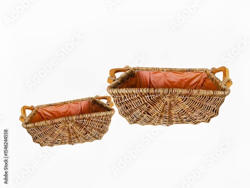 The white background in the picture is a densely woven rattan basket with two wooden handles on each side. It is covered with a reddish brown burlap cloth for beauty and multipurpose use in the home.