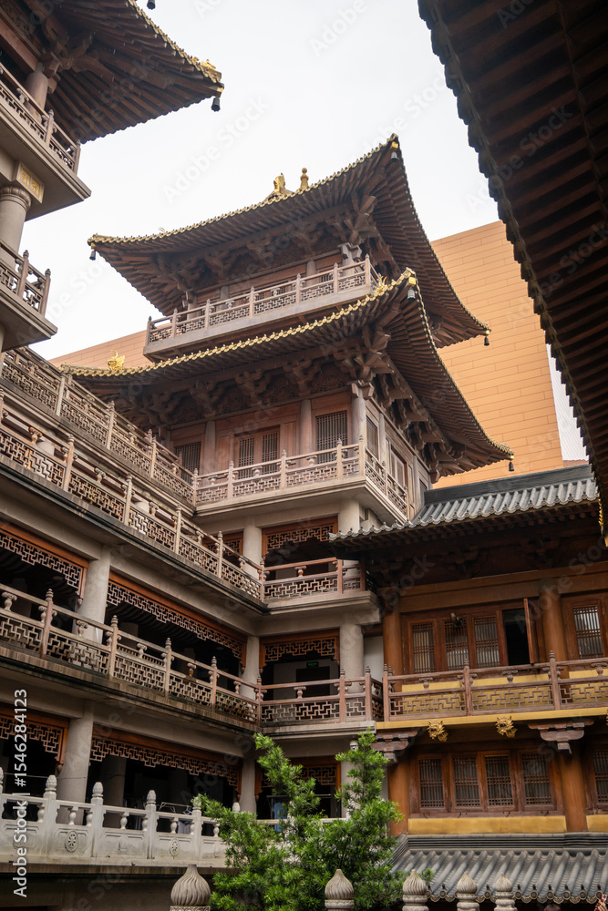Complex layers in Jing'an Temple in Shanghai, China. The rebuilt complex exhibits traditional Chinese architecture with intricate details and golden accents, reflecting Buddhist principles. Complex layers in Jing'an Temple in Shanghai, China. The rebuilt complex exhibits traditional Chinese architecture with intricate details and golden accents, reflecting Buddhist principles.