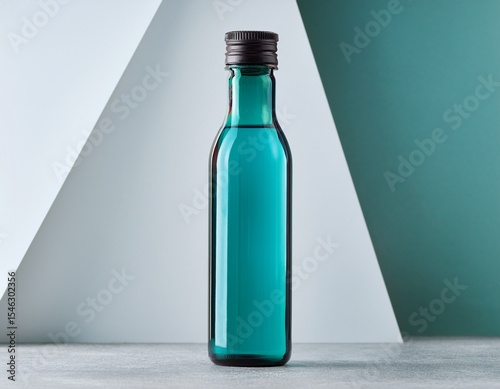 elegant teal glass bottle with dark gray cap for beverage container mockup