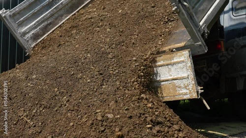 Dry Soil and Gravel Unloading from Dump Truck