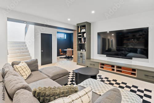 Living room with a large flat screen TV and a couch