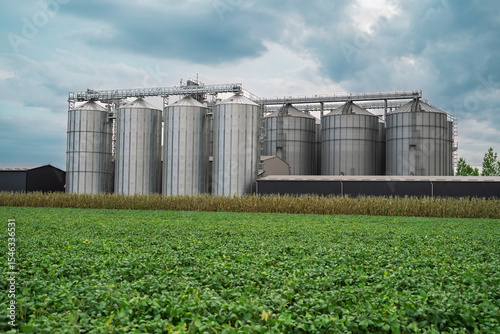 Photos Industrial silos, with soy bean field, cloudy day no people