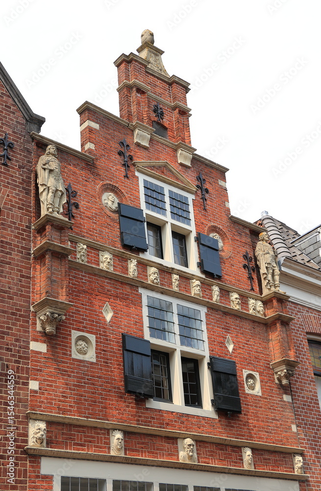 Fototapeta premium Alkmaar Pieterstraat Historic Brick House Facade with Stepped Gable and Sculpted Decoration, Netherlands