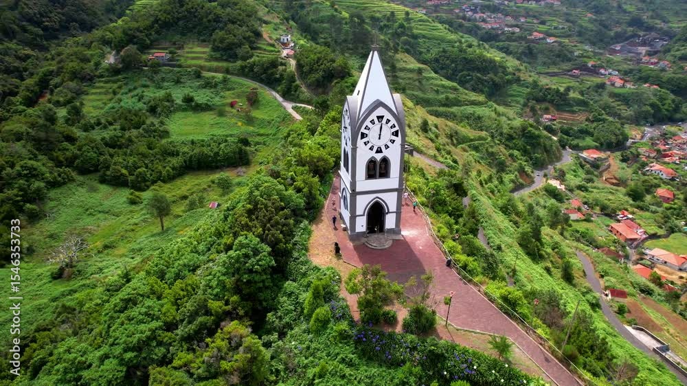 Nossa Senhora de Fatima Chapel - iconic small church of Madeira island surrounded by stunning green mountains in Sao Vicente village. aerial drone 4k hd video. Portugal
