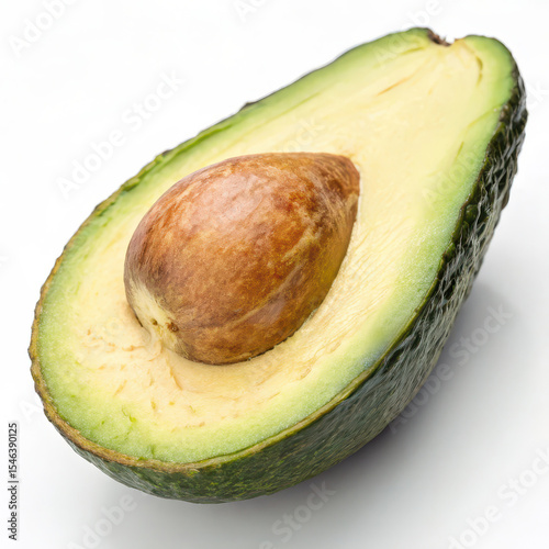 Close-up of a fresh half avocado with seed, showing creamy texture and green skin, isolated on white for food concepts.