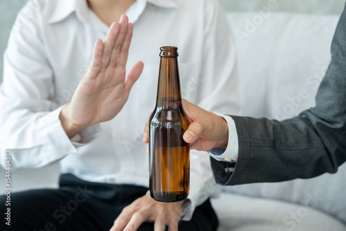 refuses say no and avoid to drink an alcohol, hand show reject and stopping, alcoholism treatment, alcohol addiction, quit booze, Stop Drinking Alcohol. Refuse bottle liquor, unhealthy