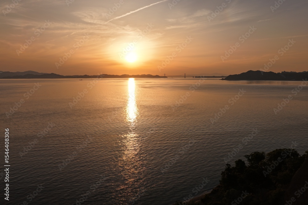 Naklejka premium Sunset Over the Naruto Strait and Bridge Seen from Awaji Island, Japan